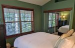 Dual windows overlooking peaceful forest from Master bedroom. 